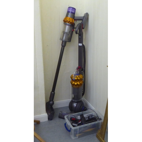 253 - Two Dyson vacuum cleaners: to include a DC50; and a V15  