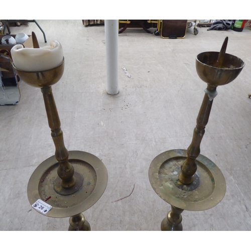 26 - A pair of modern ecclesiastically inspired brass pricket candlestands  36