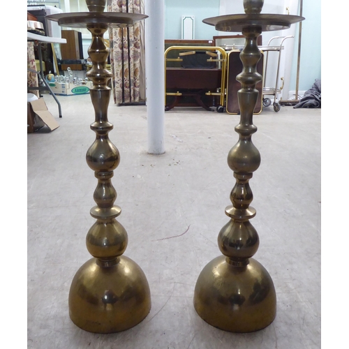 26 - A pair of modern ecclesiastically inspired brass pricket candlestands  36