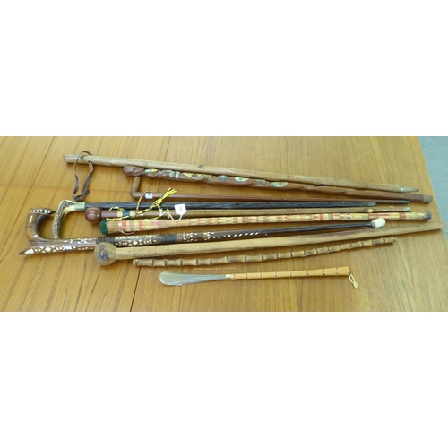 265 - Walking sticks and canes: to include a mother-of-pearl inlaid fruitwood example 