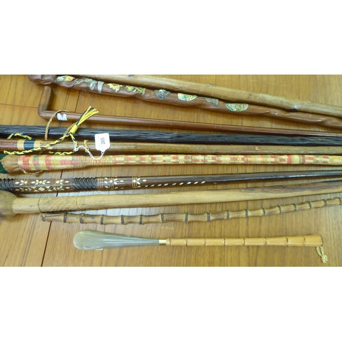 265 - Walking sticks and canes: to include a mother-of-pearl inlaid fruitwood example 