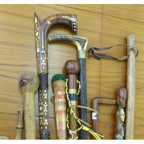 265 - Walking sticks and canes: to include a mother-of-pearl inlaid fruitwood example 