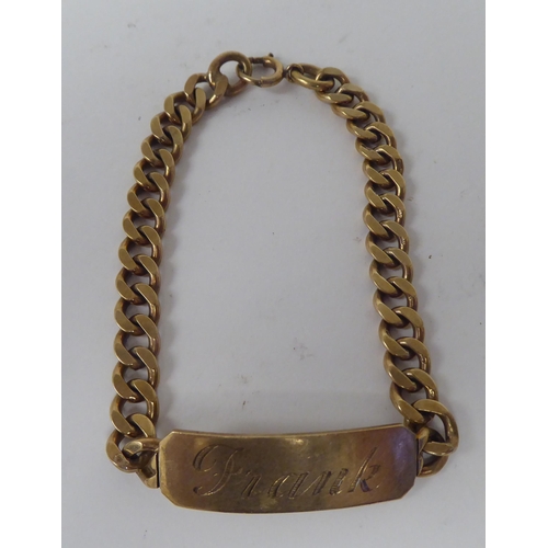 271 - A 9ct gold curb link identity bracelet 