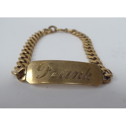 271 - A 9ct gold curb link identity bracelet 