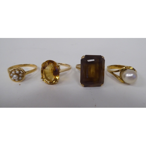 273 - Four various 9ct gold and other dress rings, one claw set with a citrine