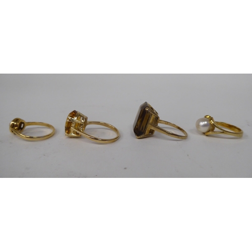 273 - Four various 9ct gold and other dress rings, one claw set with a citrine