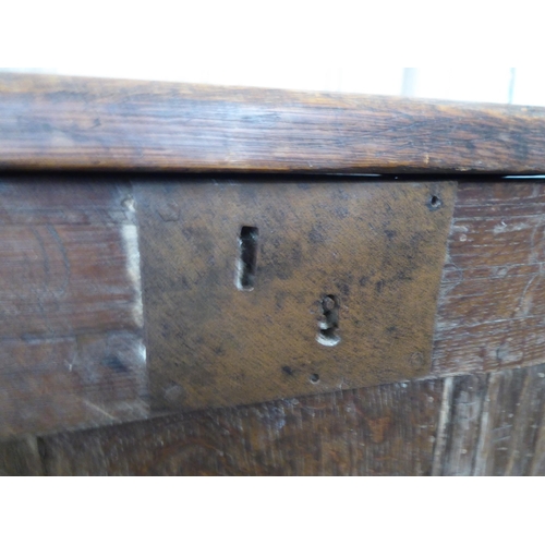 28 - An early 18thC oak coffer with straight sides and a hinged lid, on block feet  22