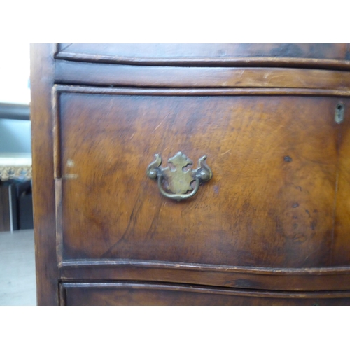 31 - Small furniture: to include an early 20thC walnut three drawer dressing chest, raised on bracket fee... 