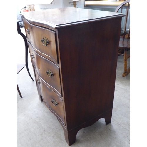 31 - Small furniture: to include an early 20thC walnut three drawer dressing chest, raised on bracket fee... 