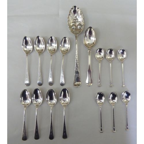 324 - Silver flatware: to include a set of six bright cut engraved teaspoons; and four seal end terminal c... 