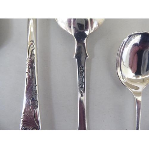 324 - Silver flatware: to include a set of six bright cut engraved teaspoons; and four seal end terminal c... 