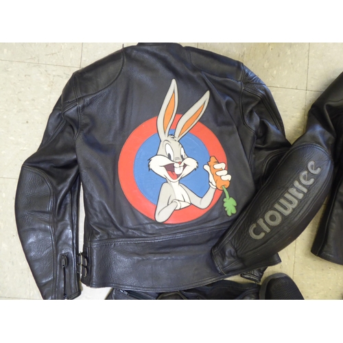 329 - Two sets of Crowtree black motorcycle leathers, one with Scoobydoo on the back of one jacket, the ot... 