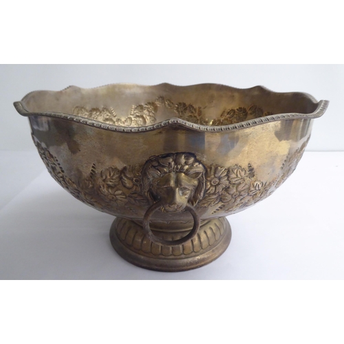 33 - A Georgian style silver plated on copper, pedestal punch bowl with opposing lion mask and ring handl... 