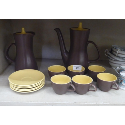 333 - A Poole pottery brown and cream glazed coffee set; and Wedgwood bone china tableware 