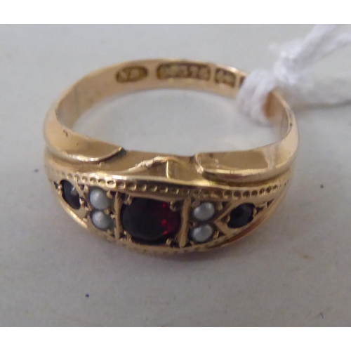 344 - A 9ct gold garnet and seed pearl ring 