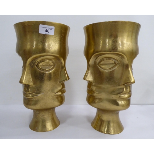 40 - Interior design items: to include a pair of gold painted, cast metal, four face vases  12