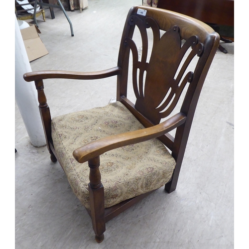 48 - Small furniture: to include a 1950s stained beech framed fireside chair