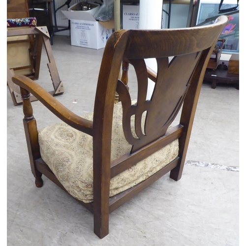 48 - Small furniture: to include a 1950s stained beech framed fireside chair