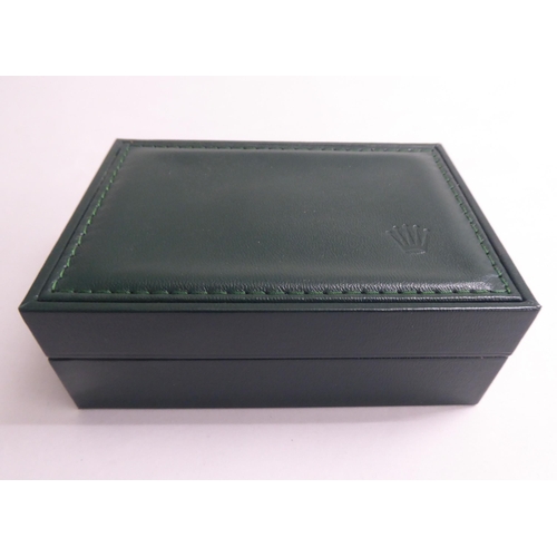 56 - A hinged Rolex watch box