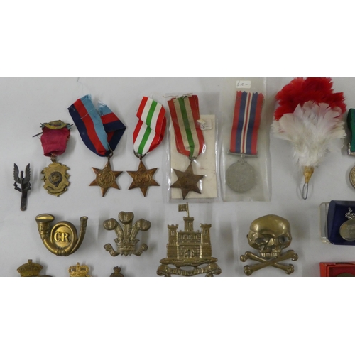 68 - Military badges, some copies: to include a cast metal skull and cross bones(Please Note: this lot is... 