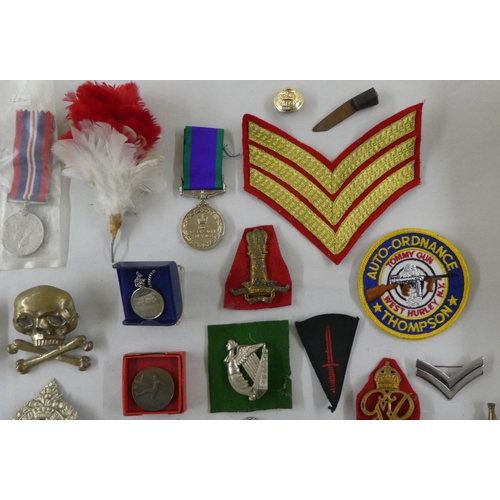 68 - Military badges, some copies: to include a cast metal skull and cross bones(Please Note: this lot is... 