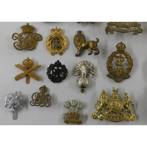 68 - Military badges, some copies: to include a cast metal skull and cross bones(Please Note: this lot is... 