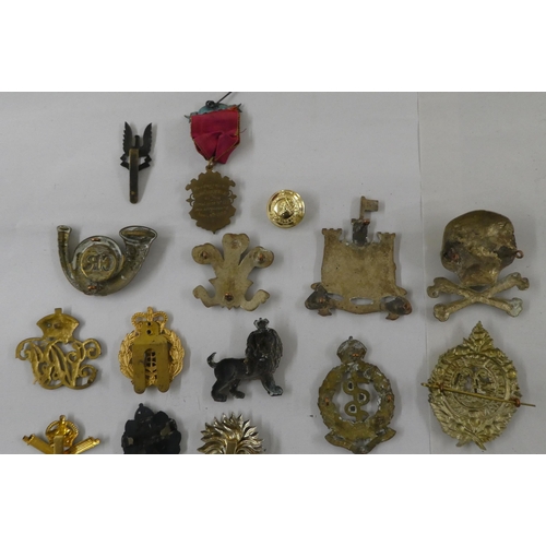 68 - Military badges, some copies: to include a cast metal skull and cross bones(Please Note: this lot is... 