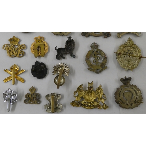 68 - Military badges, some copies: to include a cast metal skull and cross bones(Please Note: this lot is... 