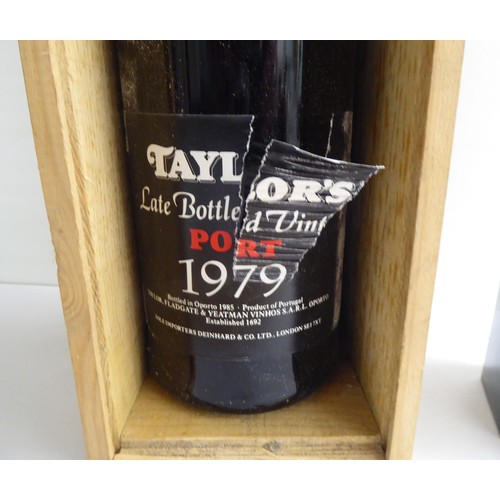 22 - A bottle of Taylors 1979 Vintage Port; and a Grahams 1994