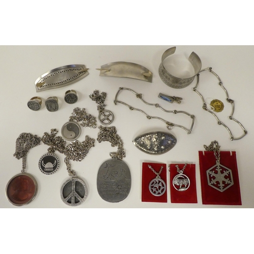 130 - Jorgen Jensen pewter items of personal ornament: to include hair barrettes and a bangle