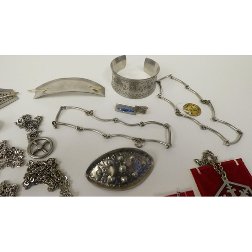 130 - Jorgen Jensen pewter items of personal ornament: to include hair barrettes and a bangle