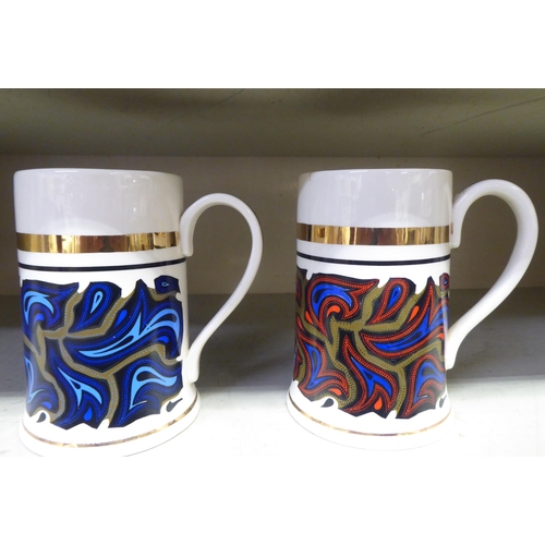 137 - Decorative ceramics: to include a pair of Robert Stewart cylindrical mugs; and a London Pottery chee... 