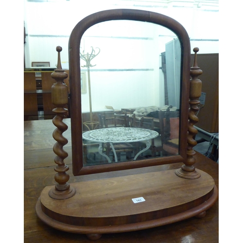 143 - A late Victorian mahogany dressing table mirror, the plate pivoting on barleytwist uprights, on a pl... 