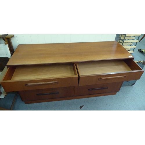 144 - A G-Plan teak dressing chest with two banks of four drawers, on a plinth  28