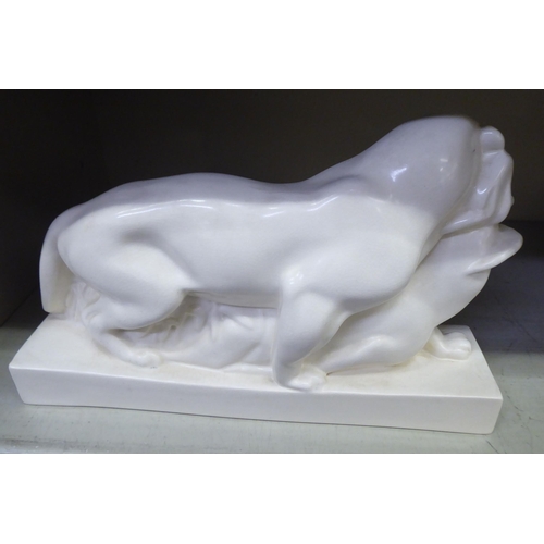 153 - A Wedgwood cream coloured glazed china model, a lioness with captured prey  bears printed & impr... 