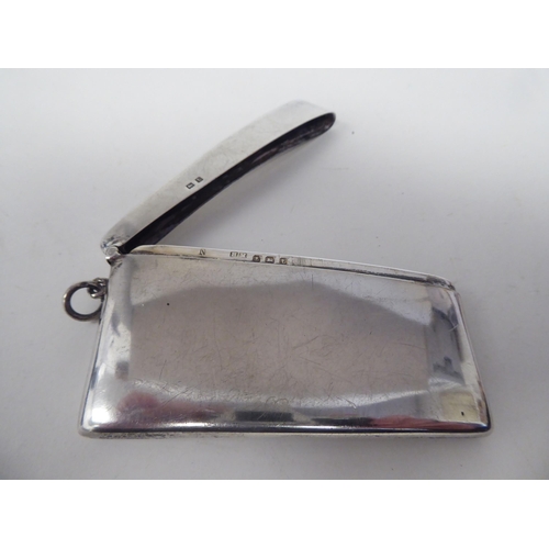 159 - A silver card case of curved form with a hinged cover  Birmingham 1918