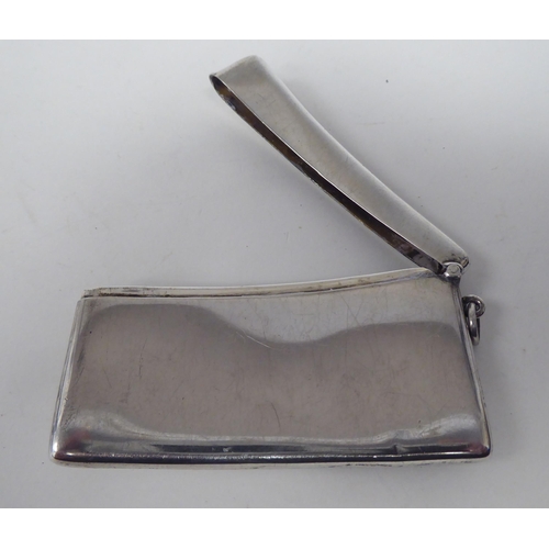 159 - A silver card case of curved form with a hinged cover  Birmingham 1918