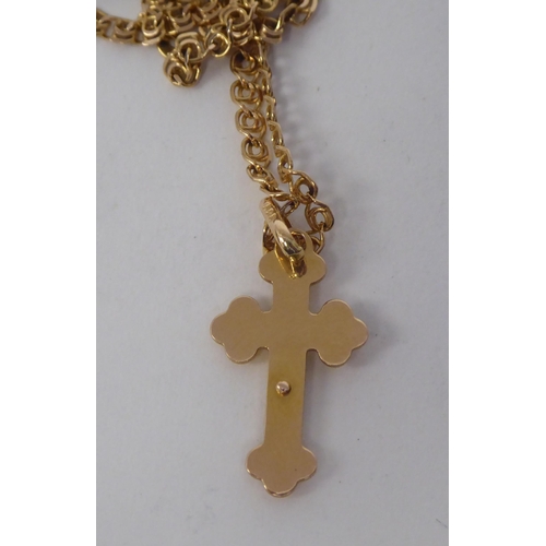 175 - A 14ct gold pendant crucifix, on a fine fancy link neckchain and ring-bolt clasp 