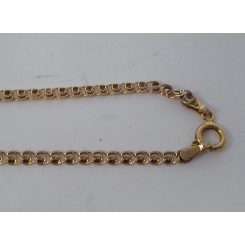 175 - A 14ct gold pendant crucifix, on a fine fancy link neckchain and ring-bolt clasp 