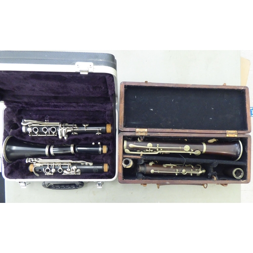 176 - A La Fleur & Son clarinet, in a compartmented wooden case; and a similar, J Michael Japanese exa... 