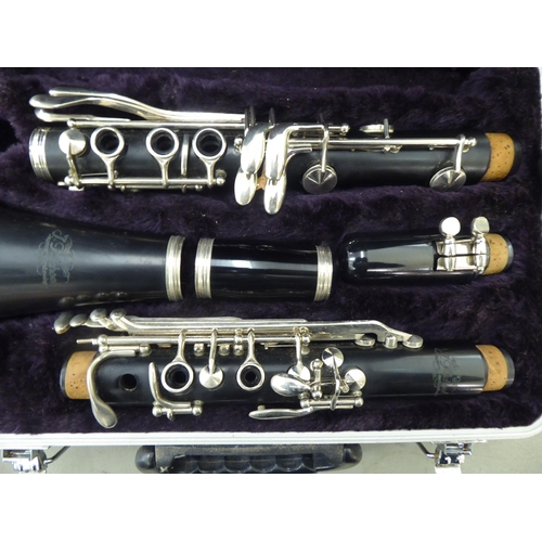 176 - A La Fleur & Son clarinet, in a compartmented wooden case; and a similar, J Michael Japanese exa... 