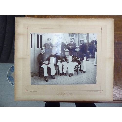 186 - A folio collection of photographic prints: to include 'The Crew of HMS Lion 1899'