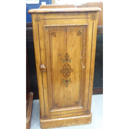 190 - Two similar late Victorian painted pine bedside cabinets, each with a single door, on a plinth  31