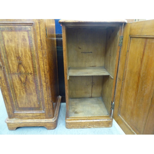 190 - Two similar late Victorian painted pine bedside cabinets, each with a single door, on a plinth  31