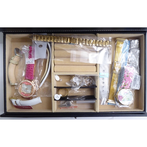 195 - Fourteen variously cased and strapped wristwatches; and some spare straps, in a watch box