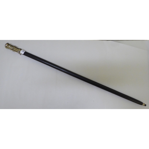 205 - An ebonised walking stick, the chromium plated handle incorporating a telescope