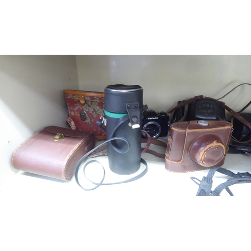 210 - Photographic and optical equipment: to include a Canton K200; and a pair of Tasco binoculars 