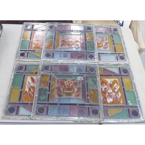 222 - Six stained and leaded glass panels, each decorated with floral images  15.5