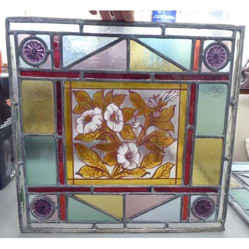 222 - Six stained and leaded glass panels, each decorated with floral images  15.5