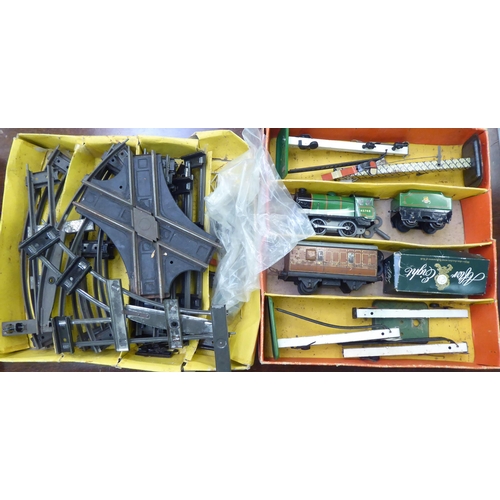 243 - Hornby tinplate 0 gauge model trains, track and accessories: to include a clockwork Goods Set No.30;... 